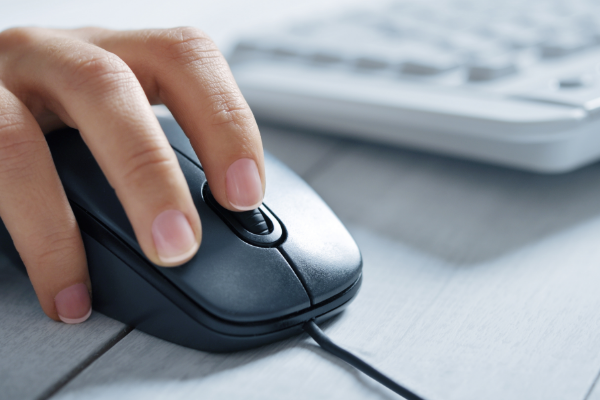 Person using a mouse and keyboard